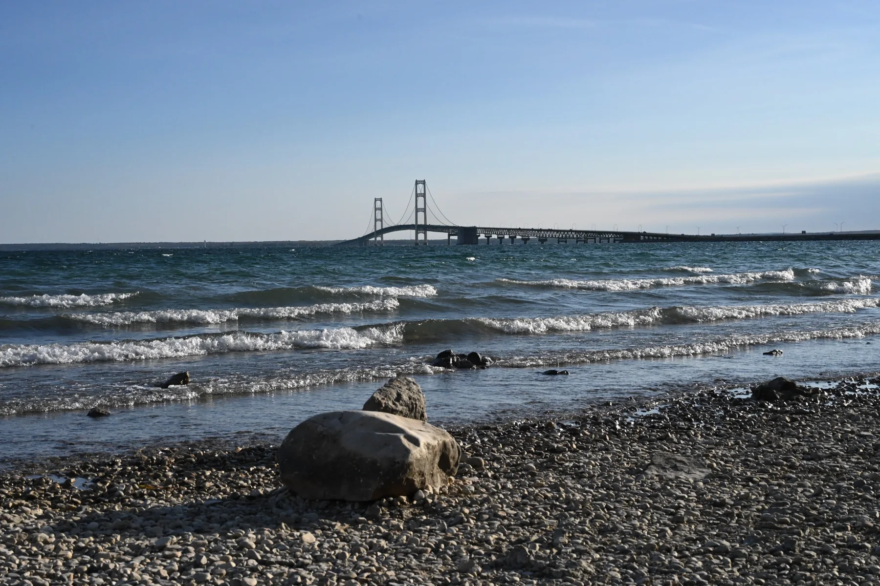 Suspension bridge seen across choppy water