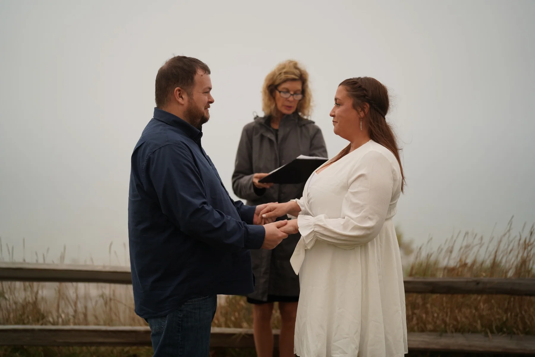 Couple exchanging vows outdoors